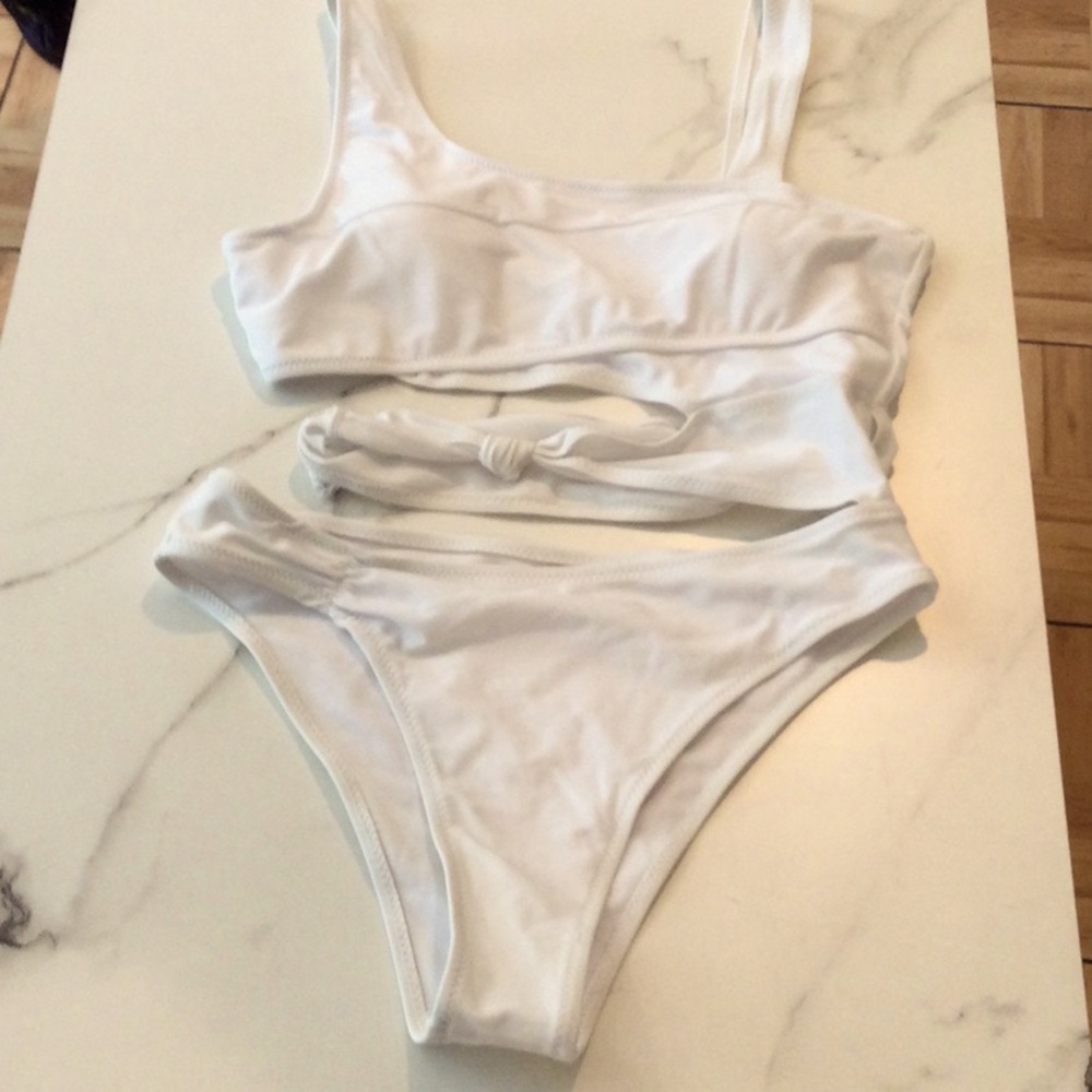 White One piece swim suit with cut outs, medium.